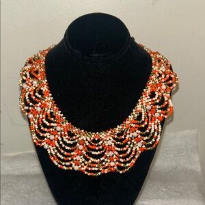 Vibrant Beaded Necklace with Orange and Black Accents